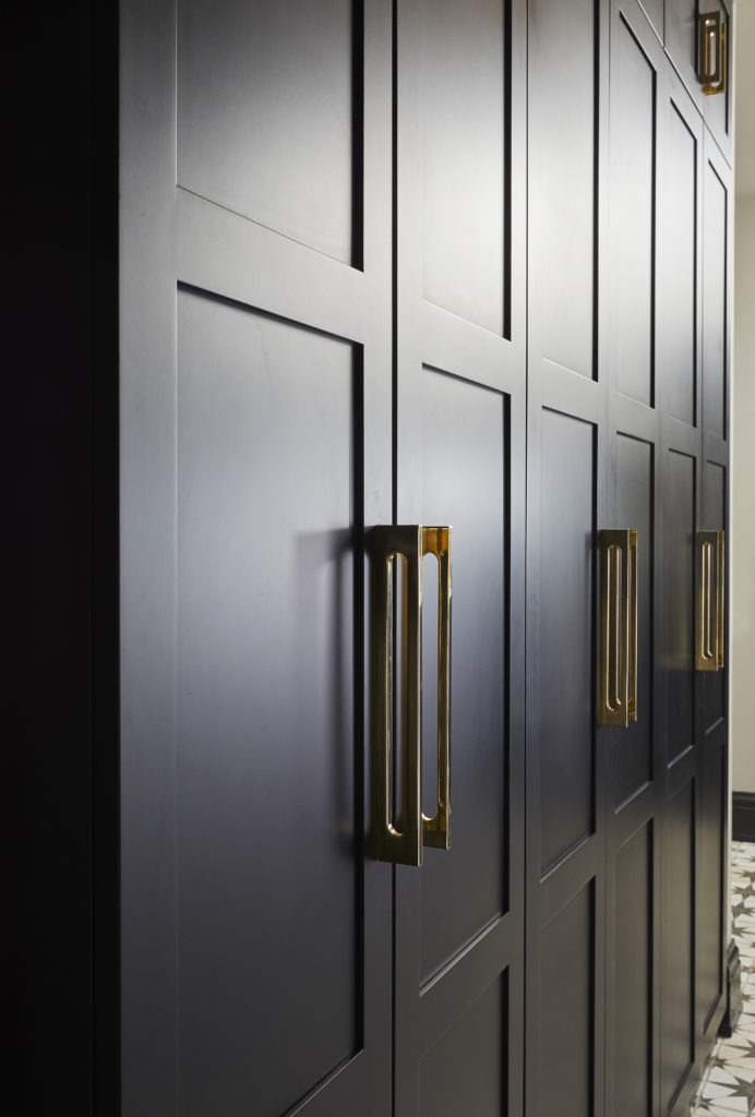 tall storage cabinets in the laundry space