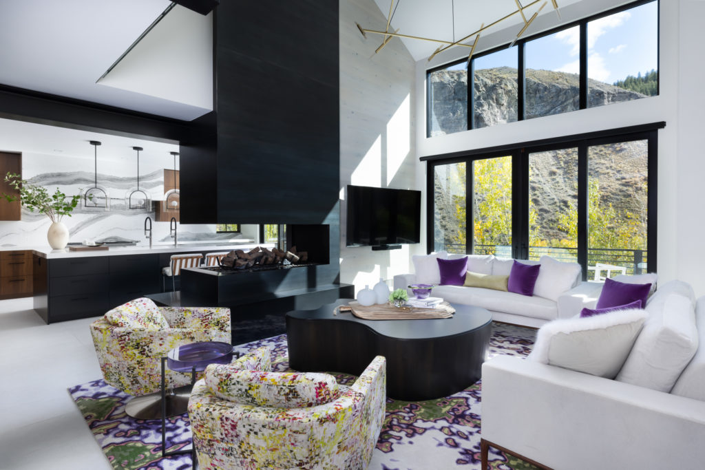 Living room with white sofa and mountain views