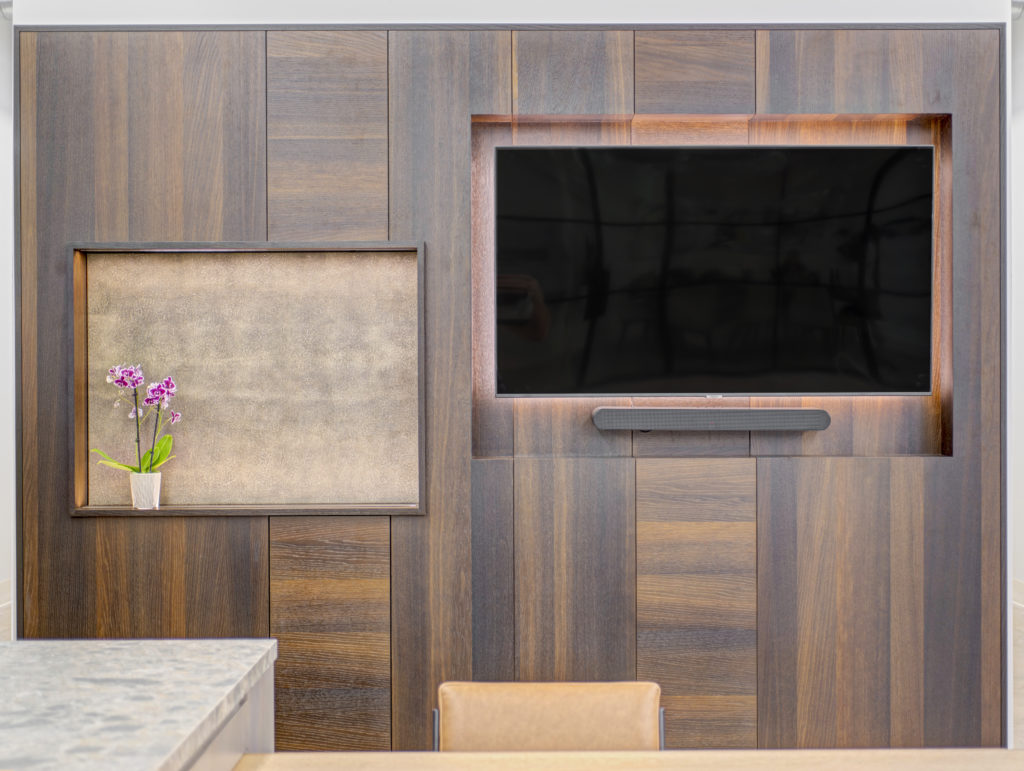 a custom made media wall with built in tv