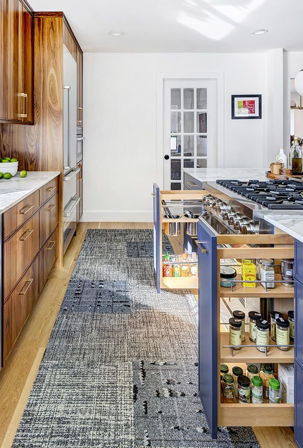 chef’s pull-out accessories on both sides of the range allow for spice storage