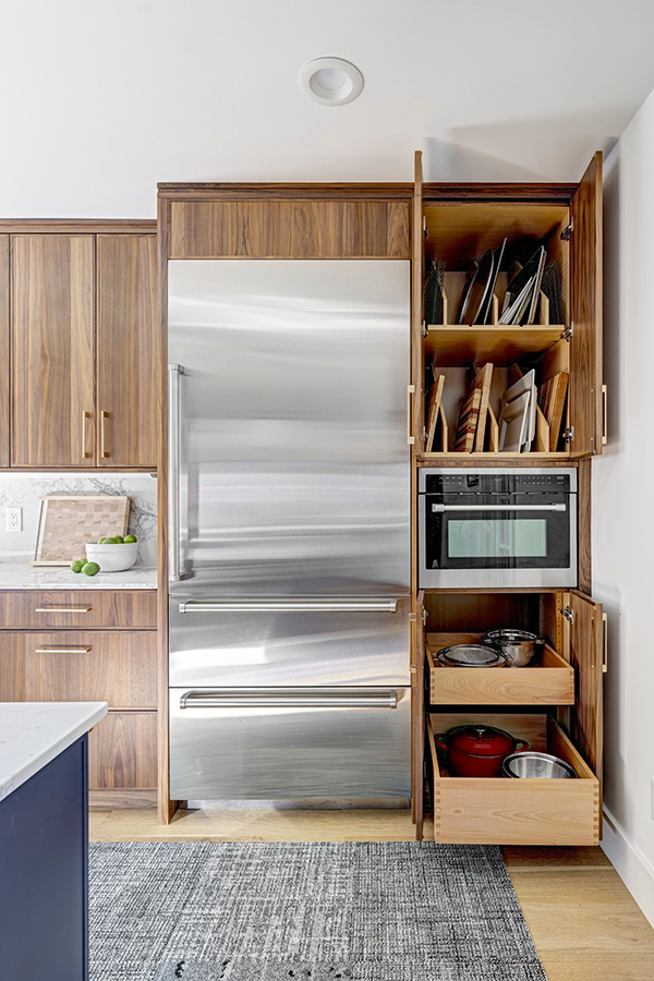 Convenient roll-out drawers provide cookware storage