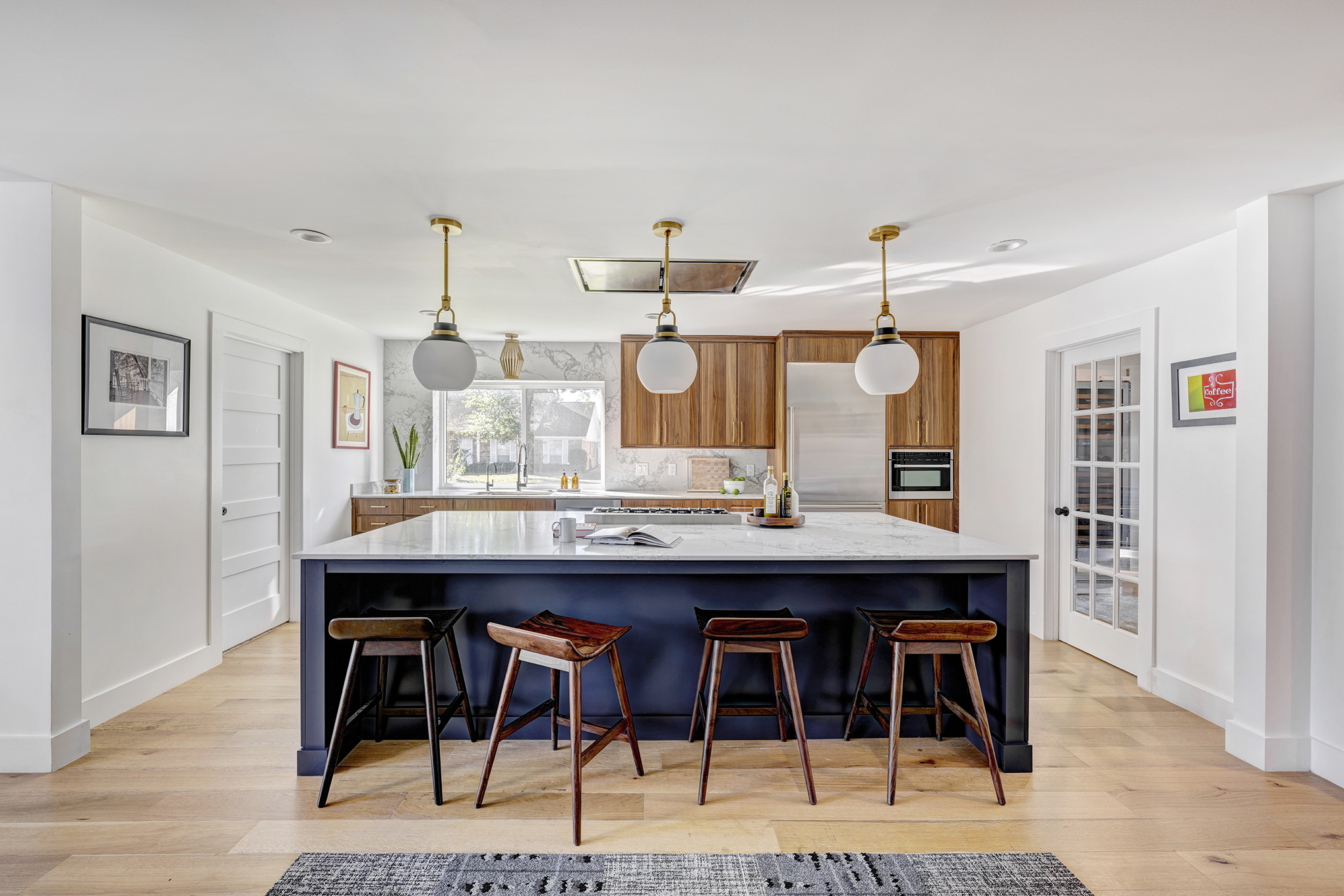 wide shot of kitchen with blue painted island