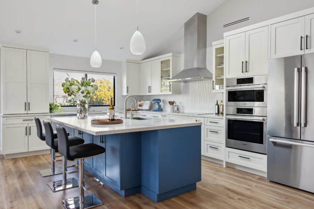 A blue painted island is the key feature of this kitchen.