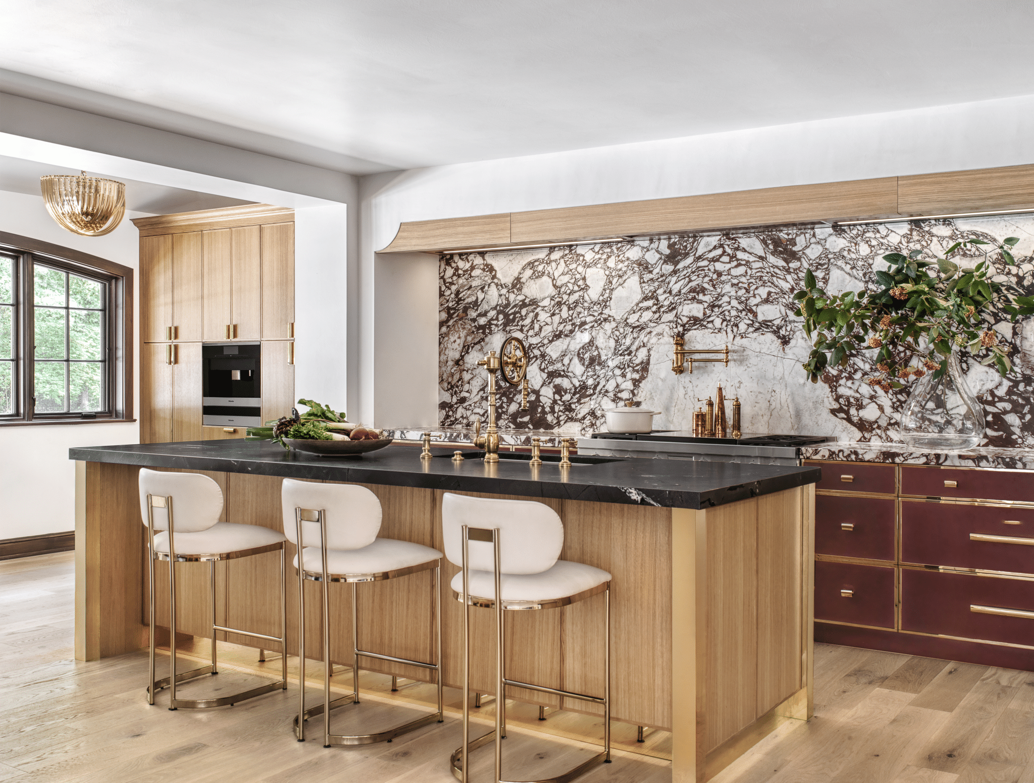 red currant painted cabinets complement bold red marble backsplash