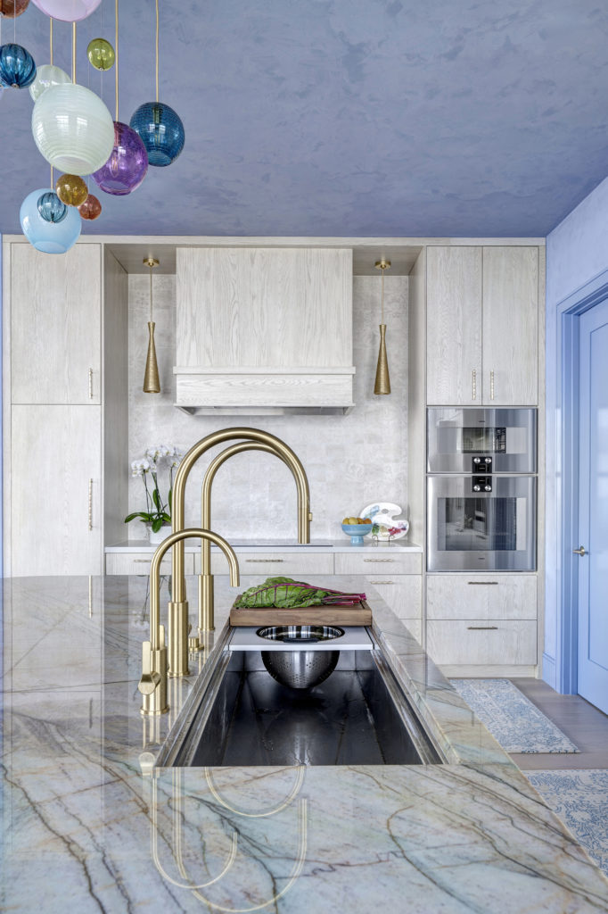 16w The Galley Tap elegant arc echoes the curve of the island radius