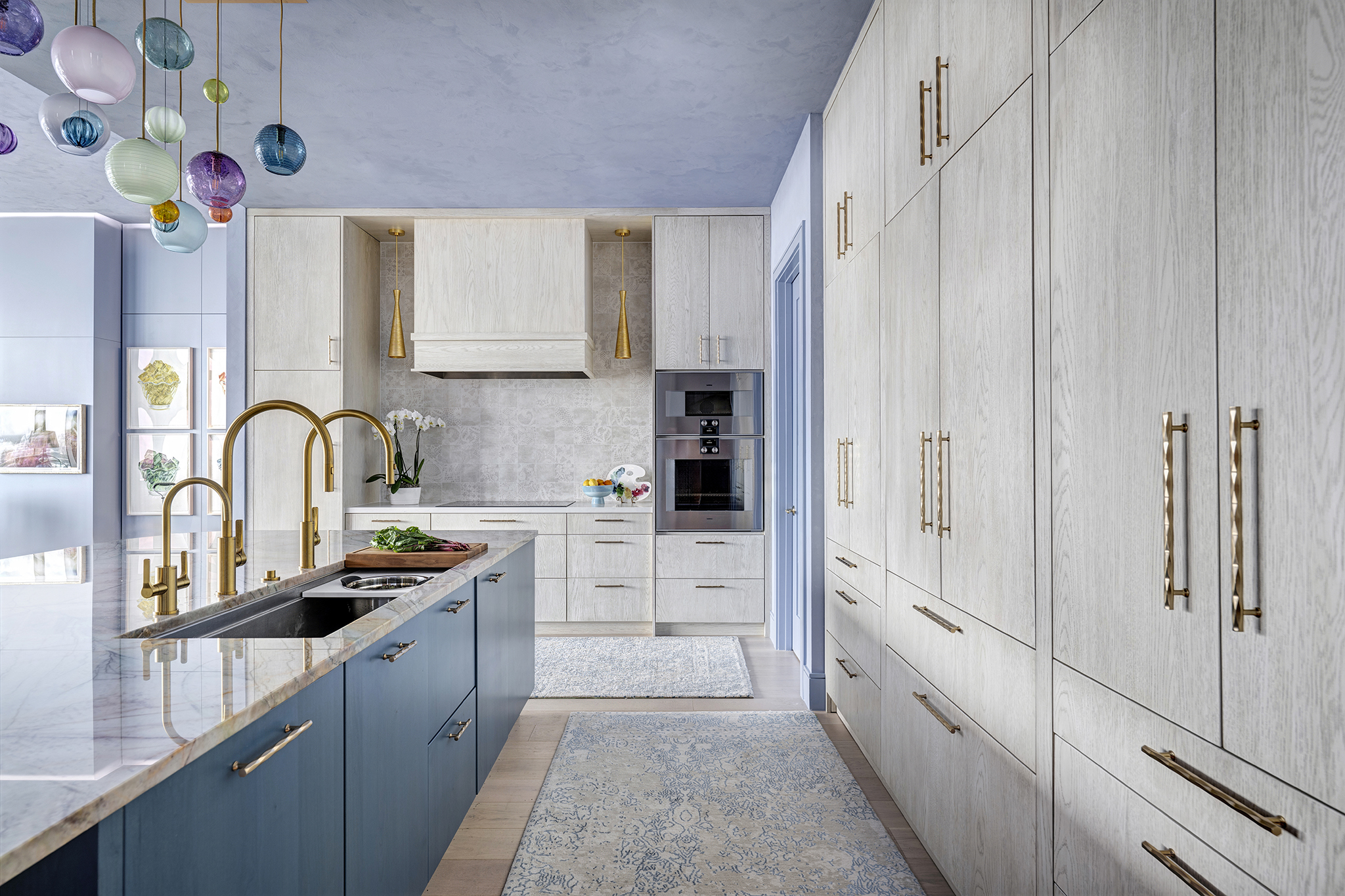 9_2w Plain Sawn White Oak in a custom finish wraps the perimeter cabinetry.