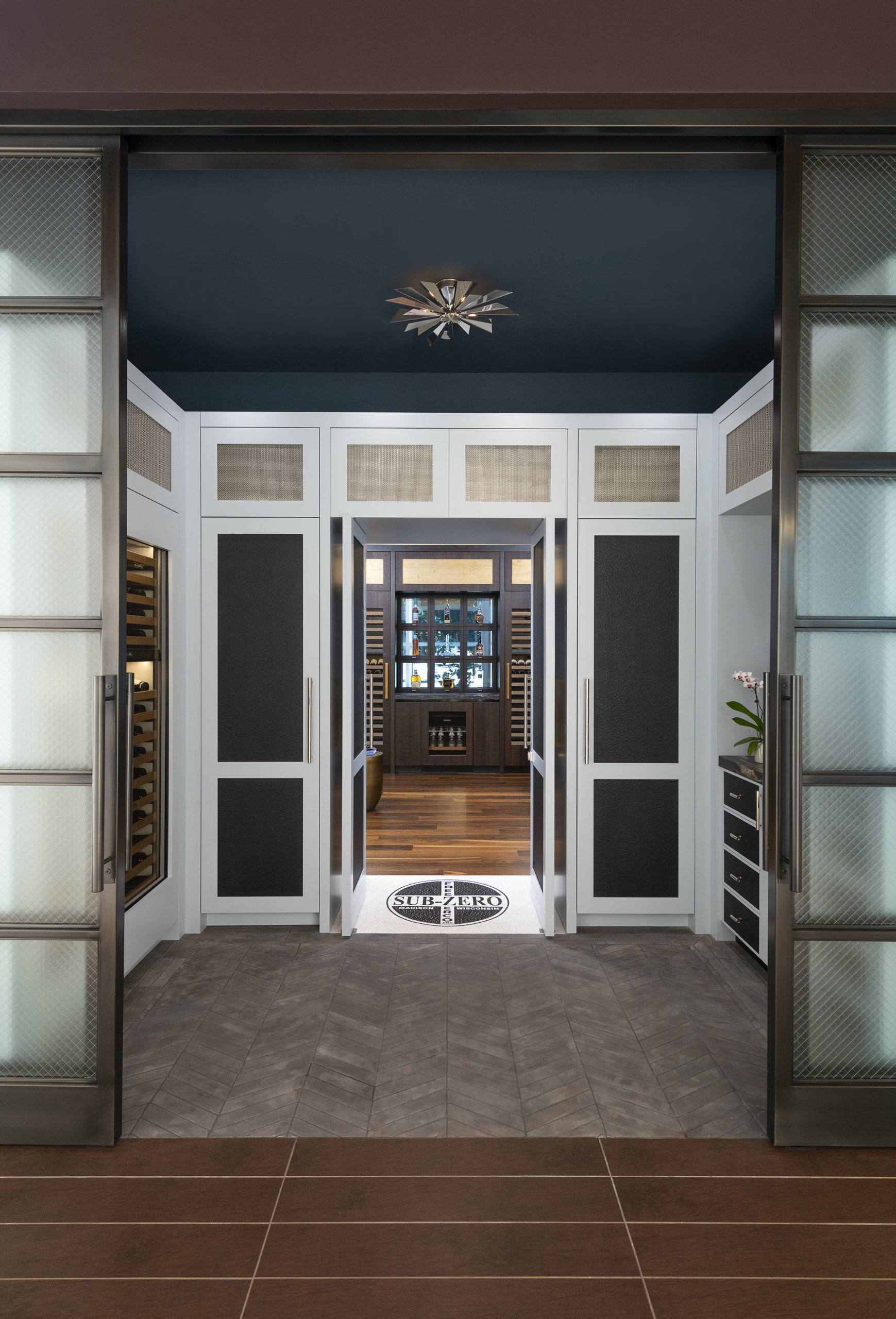 DLP_3080 Hidden pivot doors open to the Grand Bar