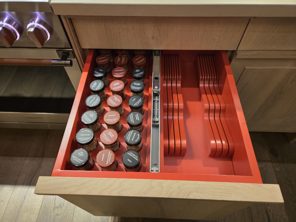 20260219_081502 A spice and prep pullout features space for spice jars as well as storage for large knives.