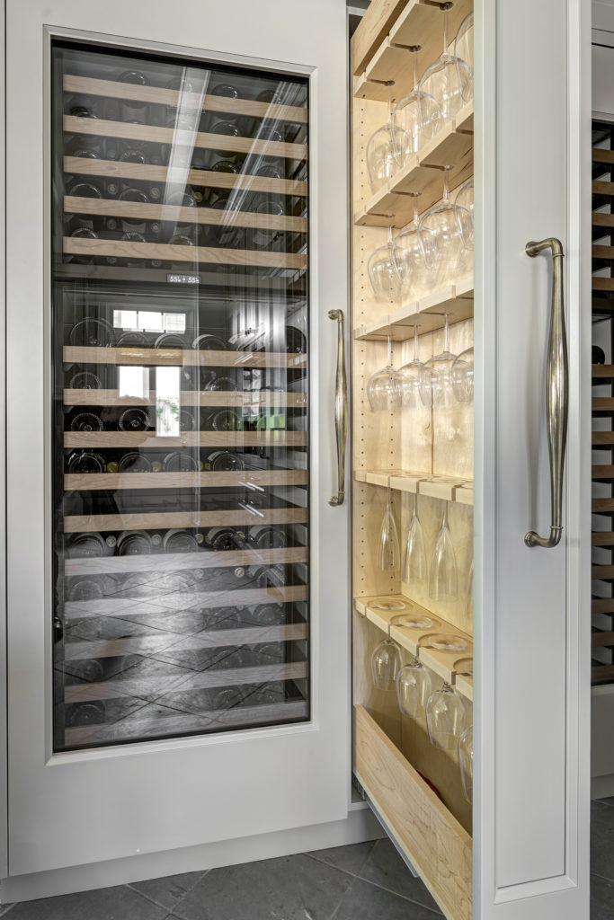 8w A wine refrigerator and custom storage for wine glasses