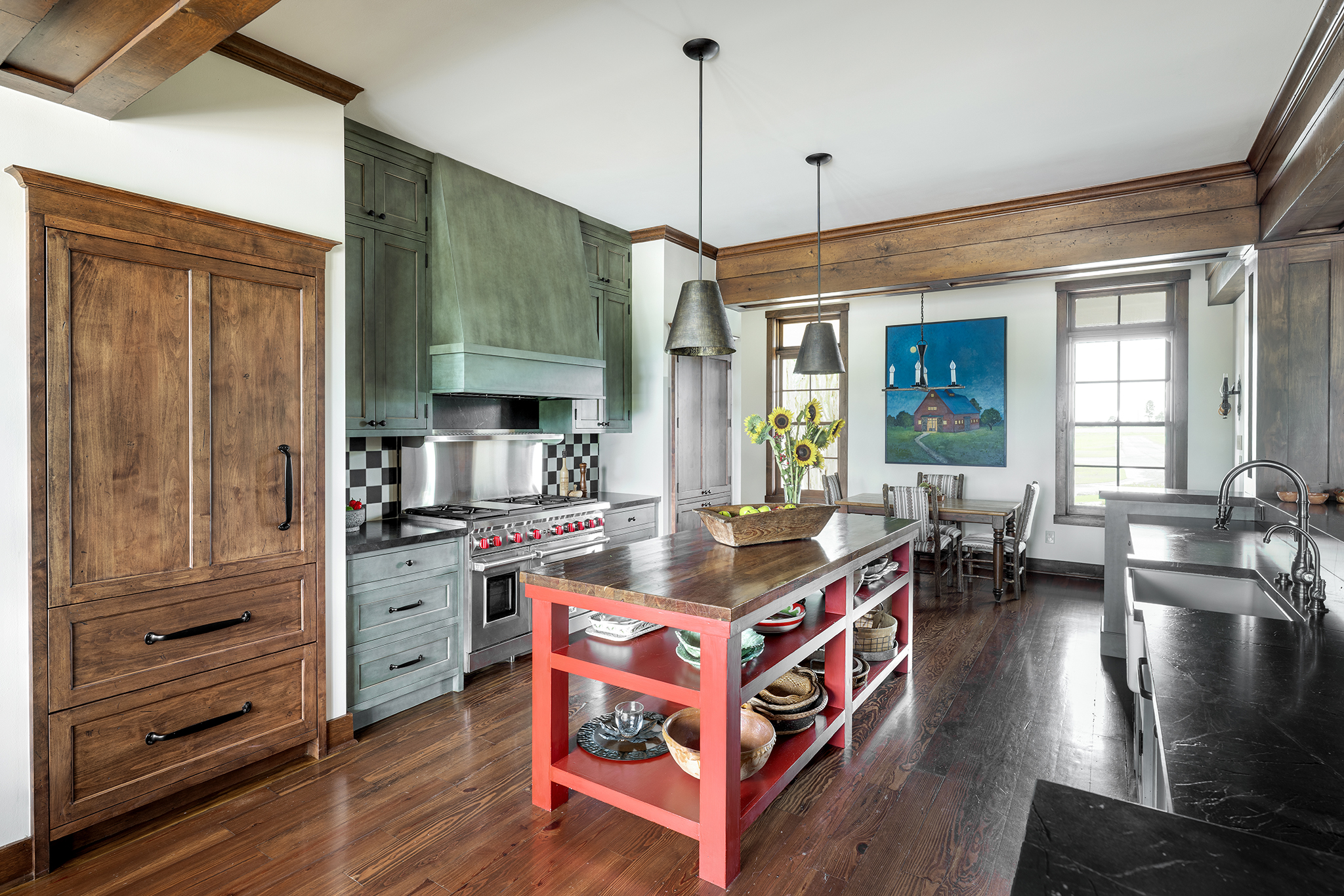 17w A sub Zero refrigerator is hidden behind the cherry wood cabinetry