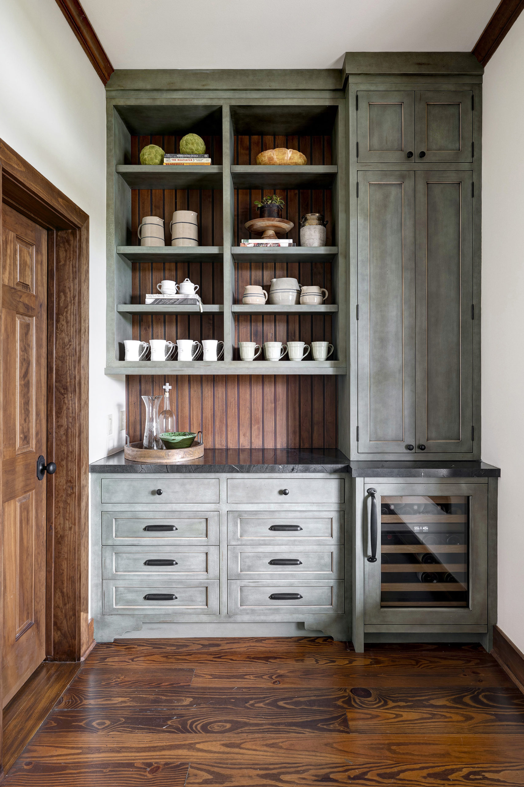 2w A drink station features storage and an undercounter wine fridge