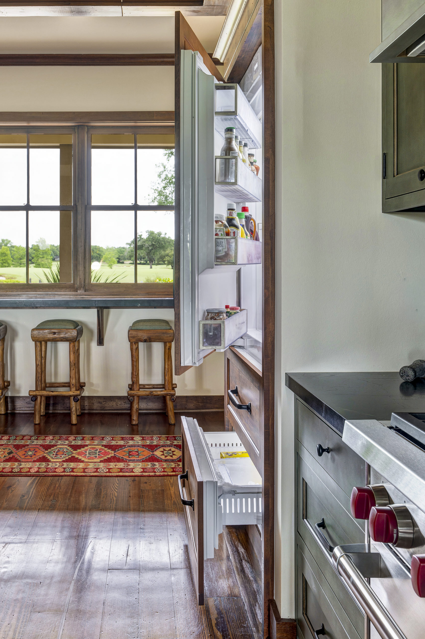 24w Refrigeration is placed behind the designer cabinetry