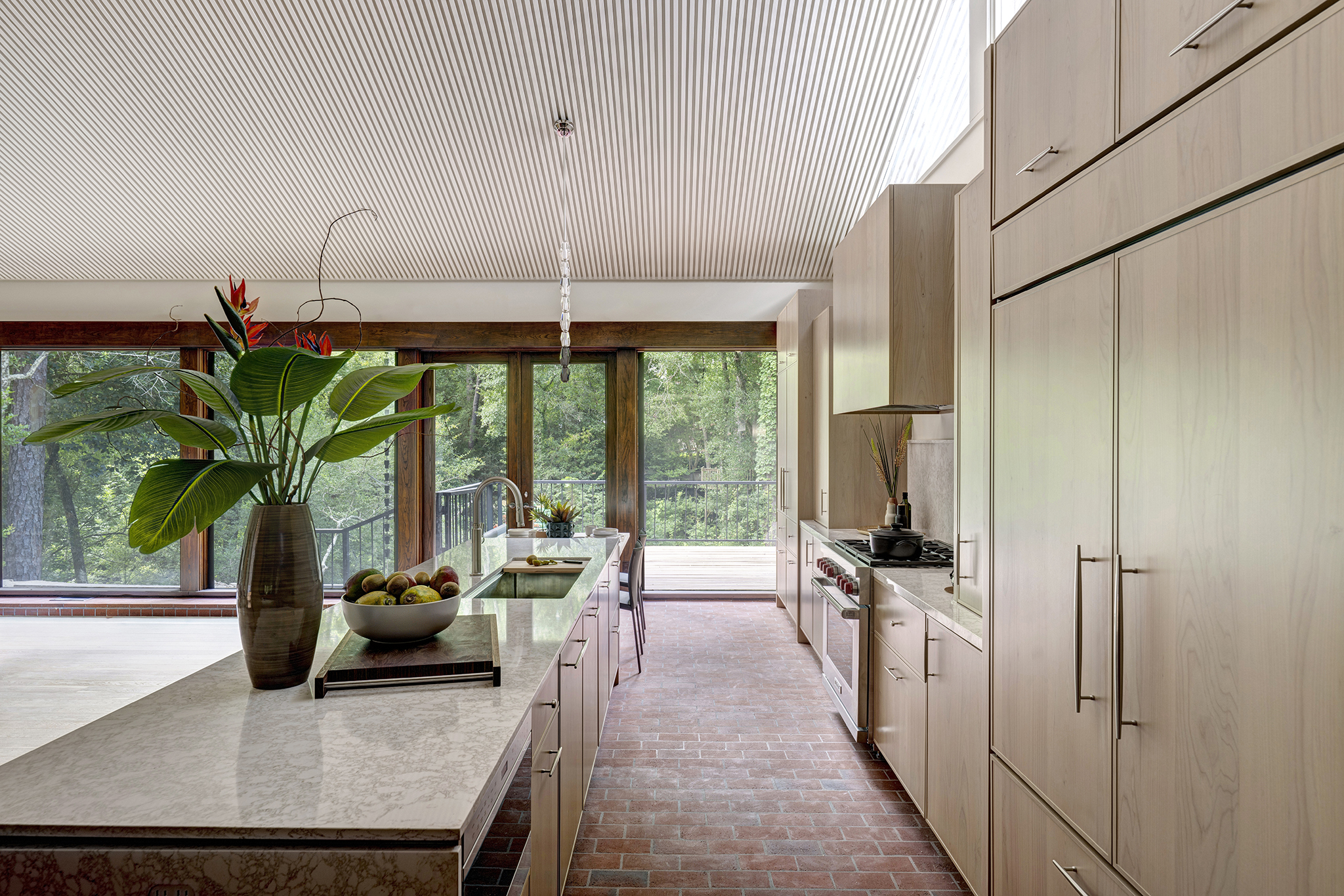 2w The Kitchen and Living areas open to picturesque views of a Buffalo Bayou tributary